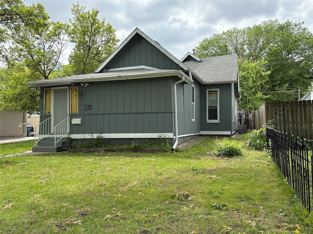 1344 21st St, Des Moines, IA 50311 - view of front of house with board and batten siding and a shingled roof