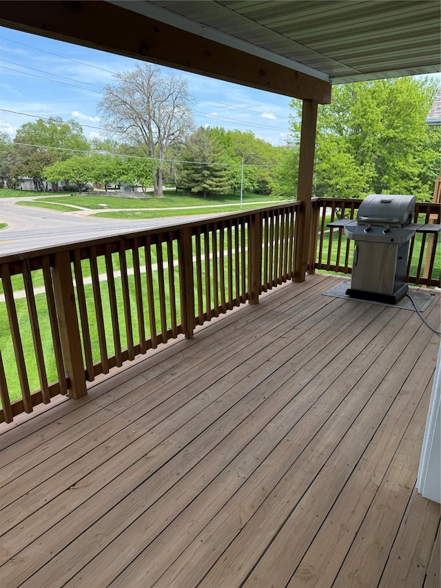 950 67th St Unit 321, West Des Moines, IA 50266 - wooden deck featuring grilling area and a lawn
