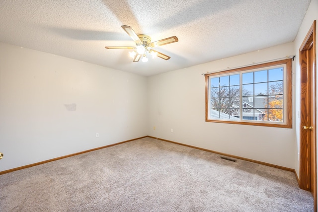 1634 Prairie Cir, Altoona, IA 50009 - unfurnished room with carpet, ceiling fan, a textured ceiling, and baseboards