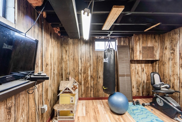 3101 Roblang Ct, Des Moines, IA 50317 - exercise area featuring wood walls and wood finished floors