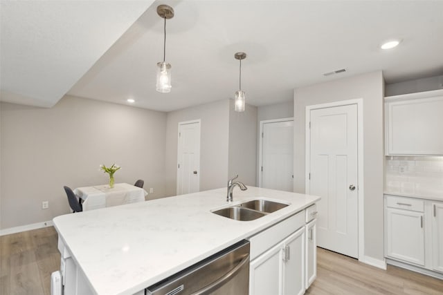 2642 SE Osier Ave, West Des Moines, IA 50265 - kitchen featuring dishwasher, light wood-style floors, white cabinetry, and recessed lighting