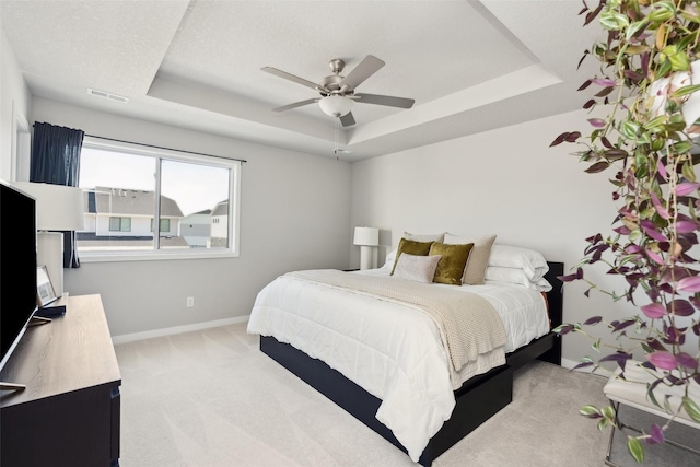 2642 SE Osier Ave, West Des Moines, IA 50265 - bedroom with a raised ceiling, carpet, and ceiling fan