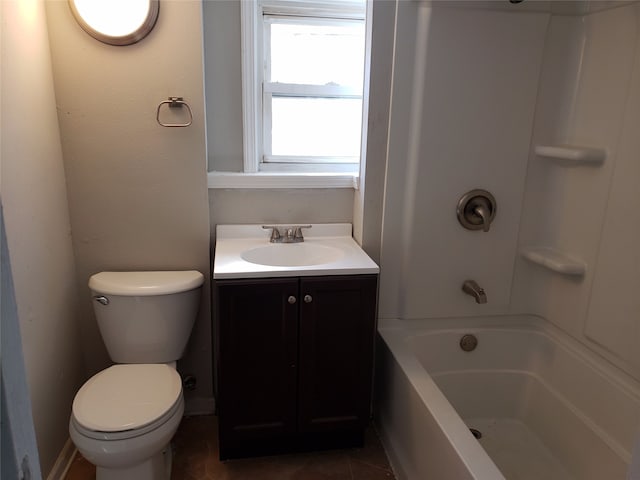 bathroom featuring toilet, vanity, tile patterned floors, and shower / bathtub combination