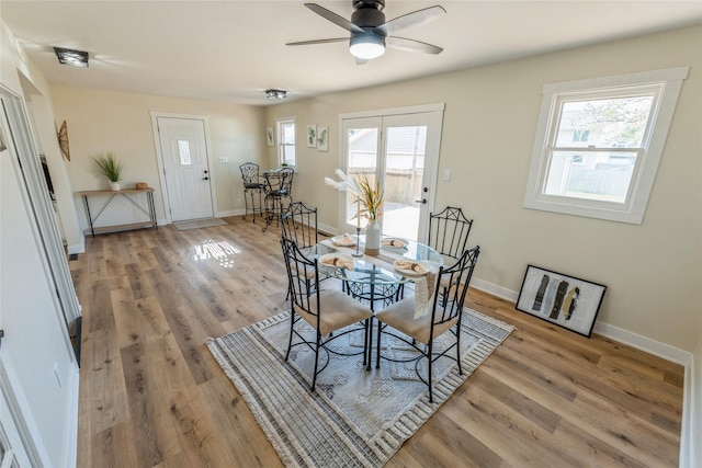 1916 Locust St, West Des Moines, IA 50265 - dining area with healthy amount of natural light, light wood-type flooring, and a ceiling fan