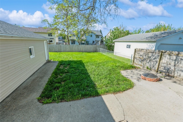 1916 Locust St, West Des Moines, IA 50265 - fenced backyard featuring an outdoor fire pit and a patio area