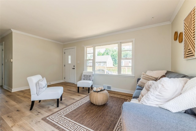1916 Locust St, West Des Moines, IA 50265 - living area featuring light wood finished floors and crown molding