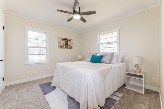 1916 Locust St, West Des Moines, IA 50265 - carpeted bedroom with multiple windows, ornamental molding, and a ceiling fan