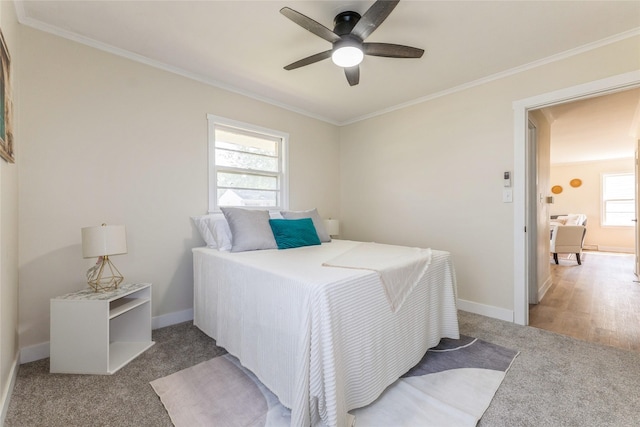 1916 Locust St, West Des Moines, IA 50265 - bedroom with carpet floors, crown molding, and a ceiling fan