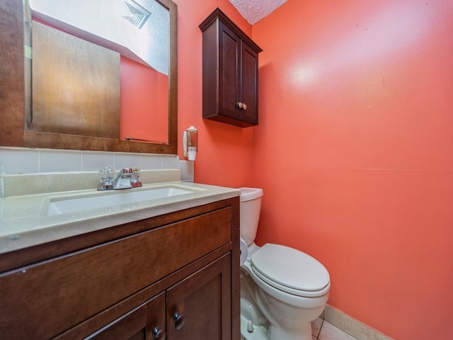 5200 Twana Dr, Des Moines, IA 50310 - half bathroom with toilet, vanity, tile patterned flooring, and baseboards