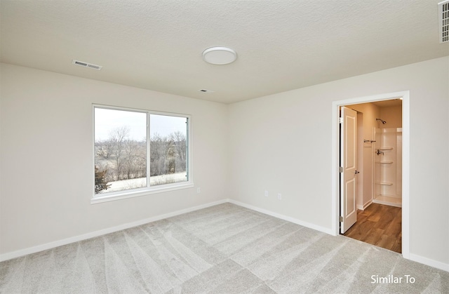 unfurnished bedroom featuring carpet and baseboards