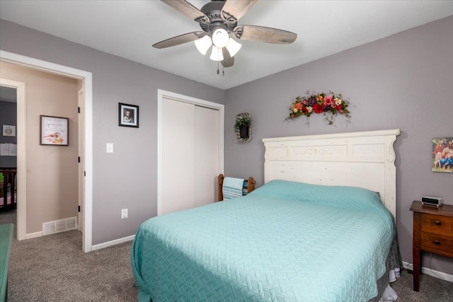 bedroom with carpet flooring, baseboards, a closet, and a ceiling fan