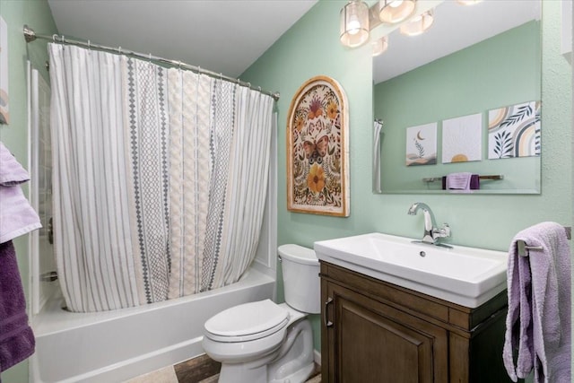 bathroom with toilet, shower / tub combo, and vanity