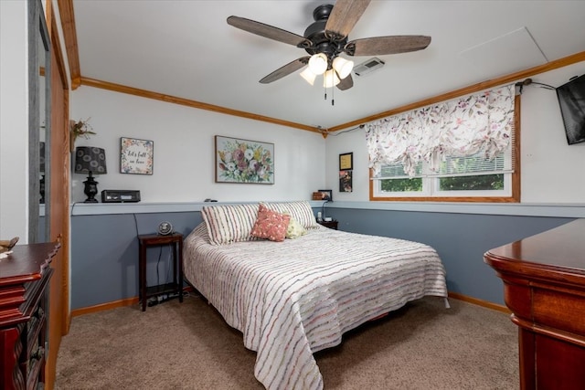 bedroom featuring ornamental molding, carpet flooring, baseboards, and a ceiling fan