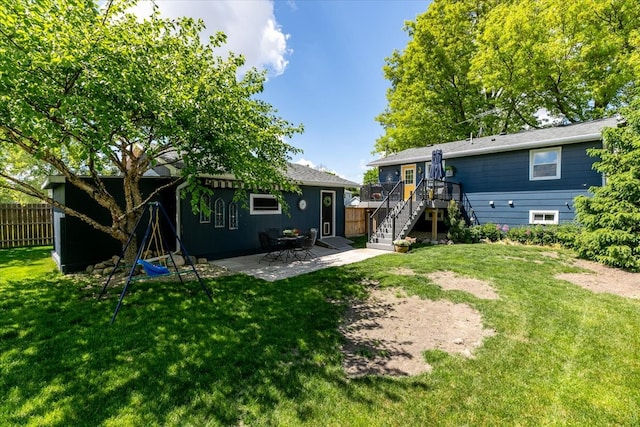 back of house with stairs, a patio, and a wooden deck