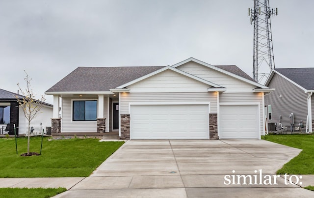 625 NW Compass Ave, Waukee, IA 50263 - craftsman-style house featuring driveway, an attached garage, a front yard, and stone siding