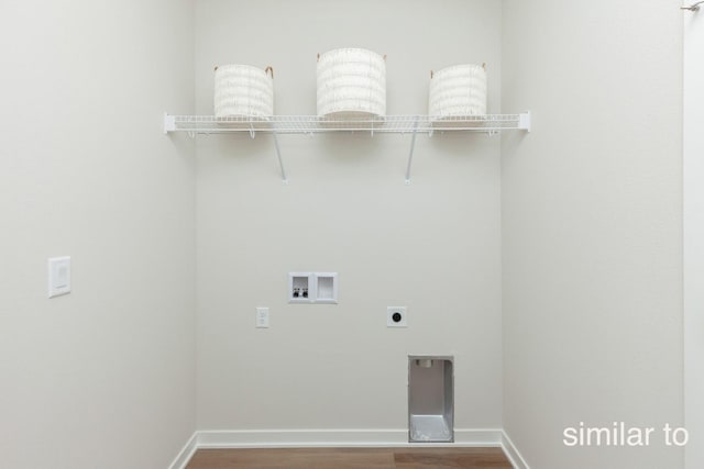 clothes washing area featuring washer hookup, wood finished floors, hookup for an electric dryer, and baseboards