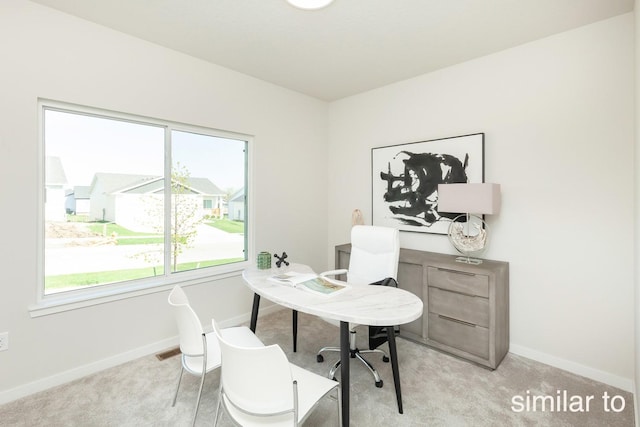 carpeted office with baseboards