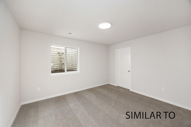 6565 NE 11th Ct, Des Moines, IA 50313 - carpeted spare room featuring baseboards