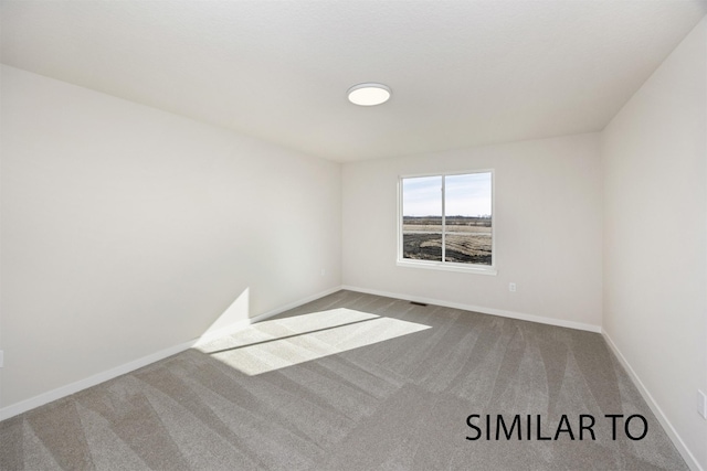 6565 NE 11th Ct, Des Moines, IA 50313 - empty room with carpet and baseboards
