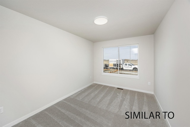 6565 NE 11th Ct, Des Moines, IA 50313 - unfurnished room featuring carpet and baseboards