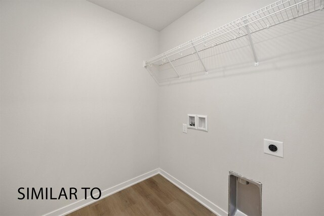 6565 NE 11th Ct, Des Moines, IA 50313 - washroom with hookup for a washing machine, electric dryer hookup, baseboards, and dark wood-type flooring