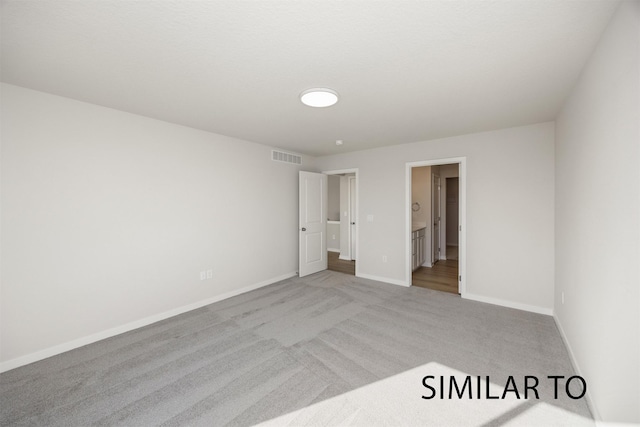 6557 NE 11th Ct, Des Moines, IA 50313 - unfurnished bedroom with carpet