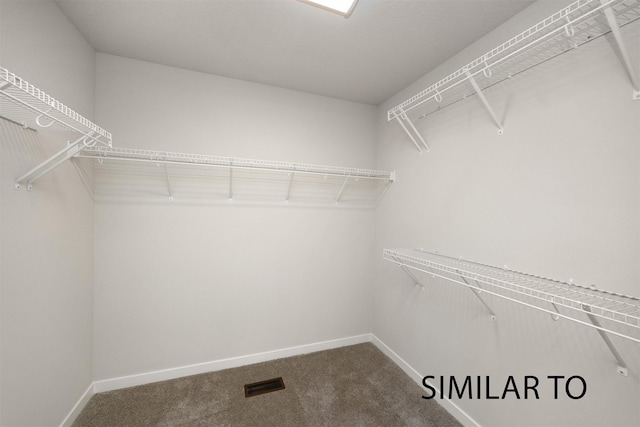 6557 NE 11th Ct, Des Moines, IA 50313 - spacious closet featuring carpet flooring