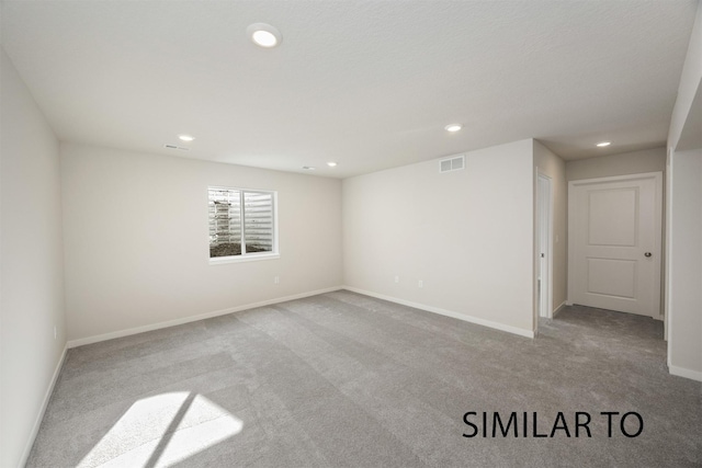 6557 NE 11th Ct, Des Moines, IA 50313 - empty room with carpet floors and recessed lighting