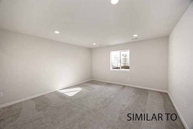 6557 NE 11th Ct, Des Moines, IA 50313 - unfurnished room featuring carpet and recessed lighting