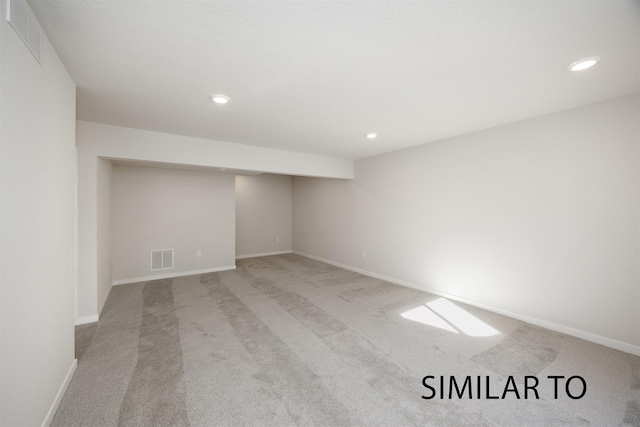 6557 NE 11th Ct, Des Moines, IA 50313 - finished below grade area with carpet floors and recessed lighting