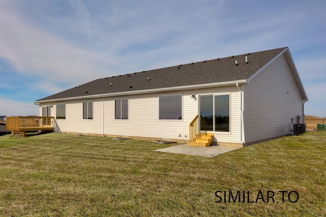 6557 NE 11th Ct, Des Moines, IA 50313 - rear view of property with a deck, a lawn, and entry steps
