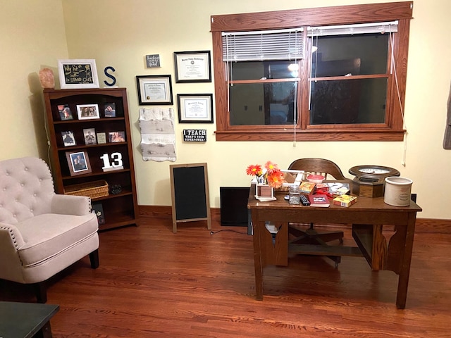 1913 N 1st St, Winterset, IA 50273 - sitting room with wood finished floors, baseboards, and a desk