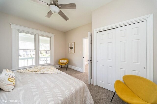 930 Forest Ave, Des Moines, IA 50314 - bedroom featuring carpet, a closet, baseboards, and a ceiling fan