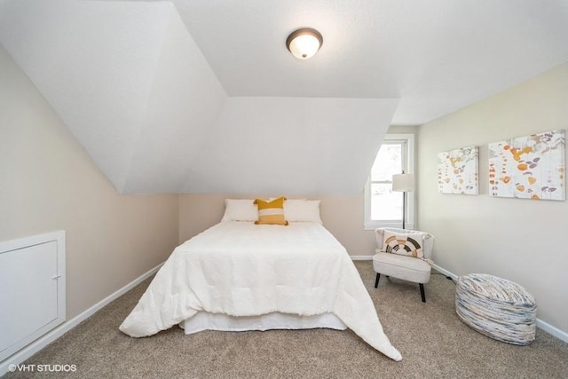 930 Forest Ave, Des Moines, IA 50314 - bedroom with carpet floors, lofted ceiling, and baseboards
