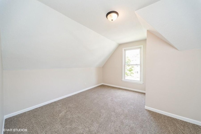 930 Forest Ave, Des Moines, IA 50314 - bonus room featuring carpet, baseboards, and lofted ceiling