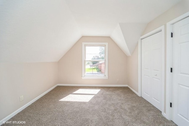 930 Forest Ave, Des Moines, IA 50314 - bonus room featuring carpet, lofted ceiling, and baseboards