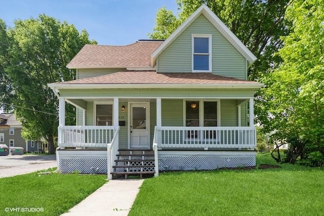 930 Forest Ave, Des Moines, IA 50314 - view of front facade featuring roof with shingles, covered porch, and a front yard