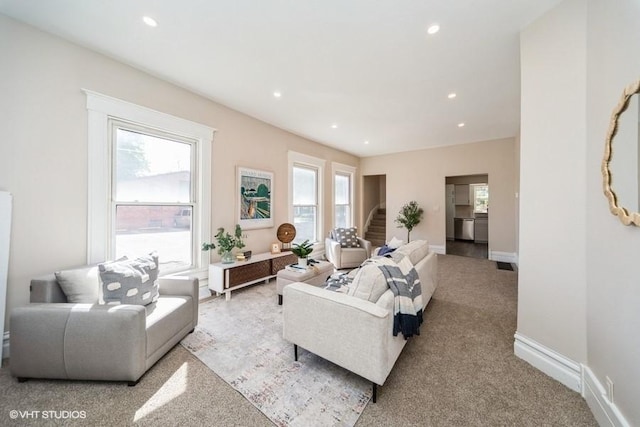 930 Forest Ave, Des Moines, IA 50314 - carpeted living area with recessed lighting, stairway, and baseboards
