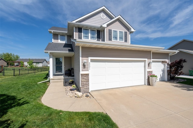 traditional-style house featuring stone siding, concrete driveway, and an attached garage