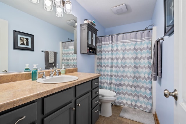 bathroom with toilet, vanity, and a shower with curtain