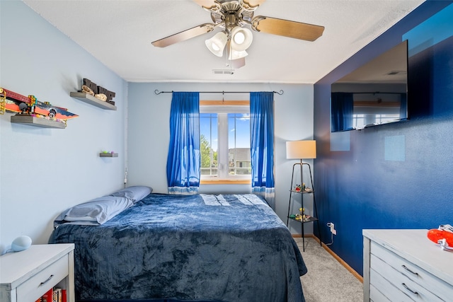 bedroom featuring carpet floors, a ceiling fan, and baseboards