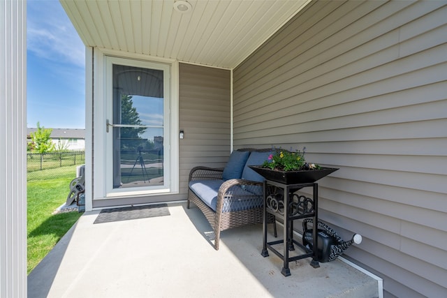 view of patio / terrace featuring fence