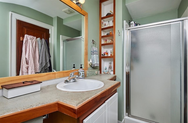 full bath featuring a shower stall and vanity
