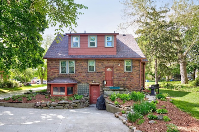 view of front of home featuring brick siding