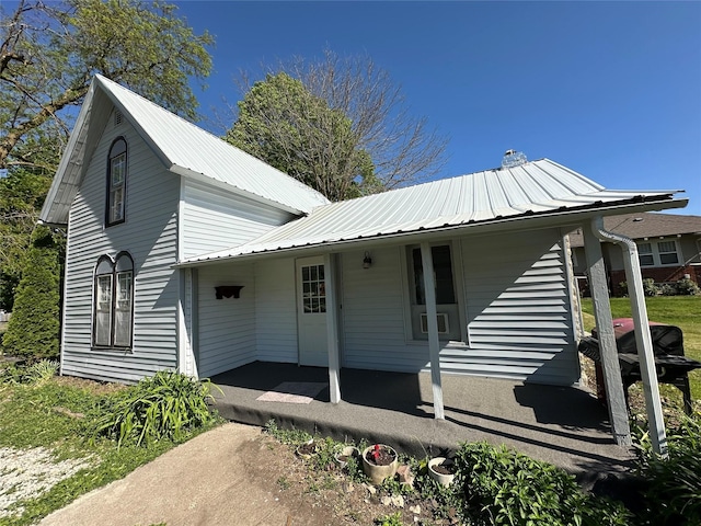 view of front of property with metal roof and a porch
