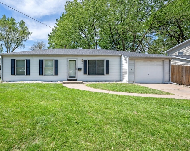 ranch-style home featuring concrete driveway