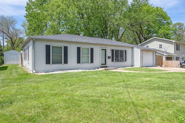 view of front of property with a garage, a storage unit, and driveway