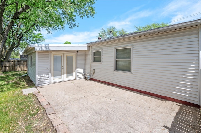 back of house with a patio area, fence, and french doors