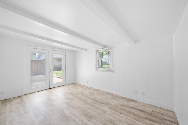 unfurnished room featuring light wood finished floors, beamed ceiling, french doors, and baseboards