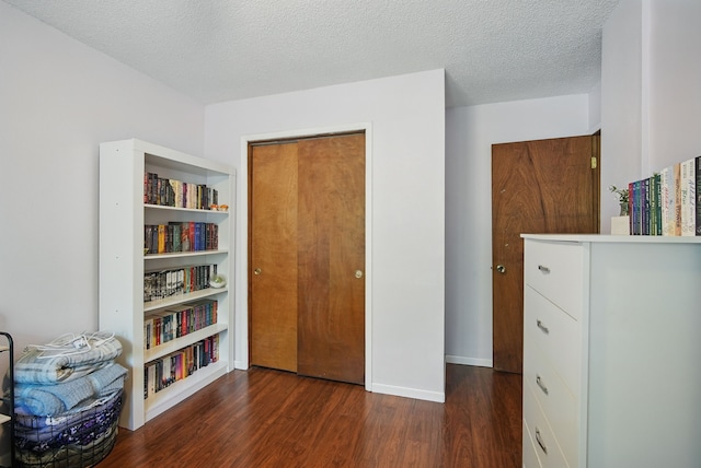 7052 Plum Dr, Urbandale, IA 50322 - bedroom with wood finished floors and a textured ceiling